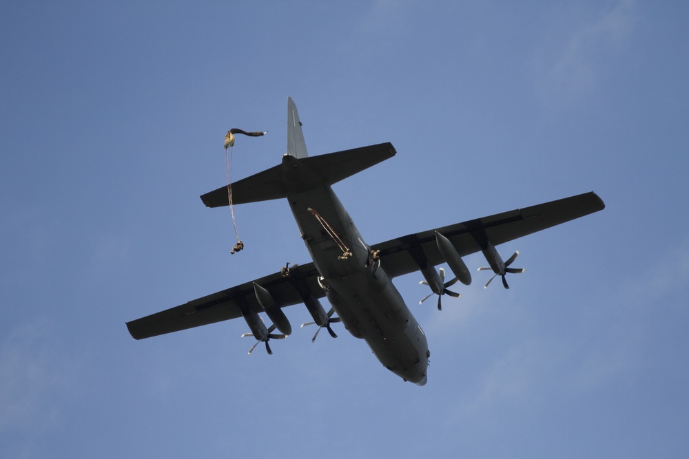 Paratroopers exit aircraft during Falcon Leap