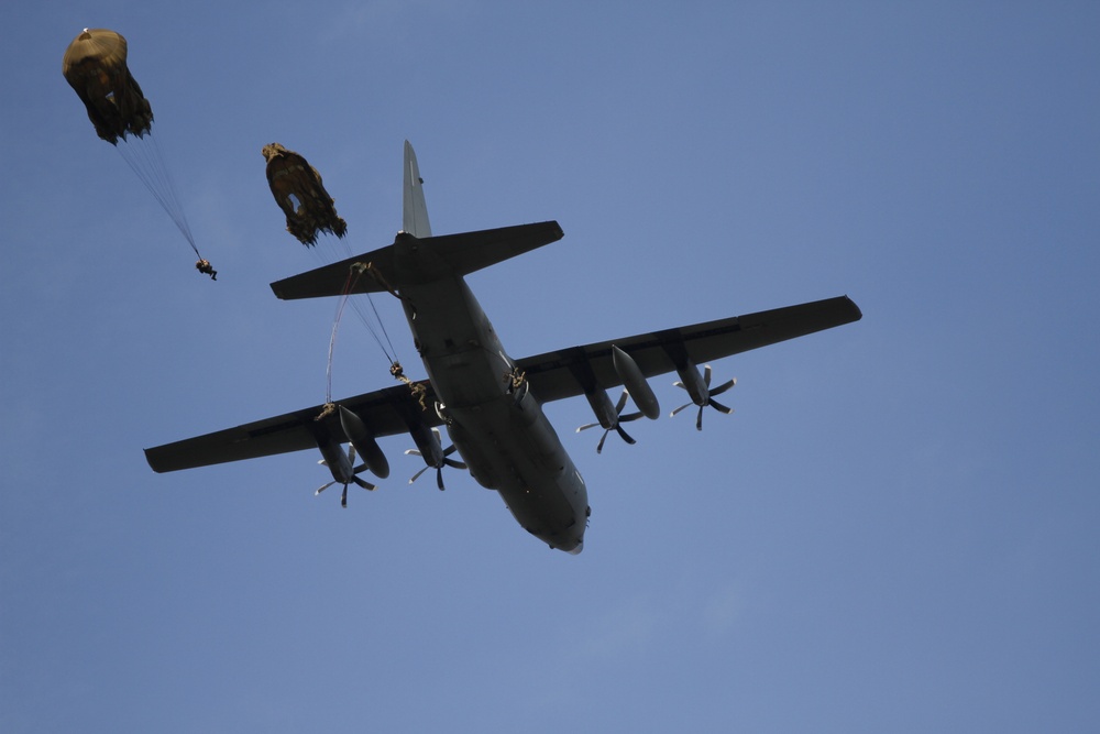 Paratroopers exit aircraft during Falcon Leap