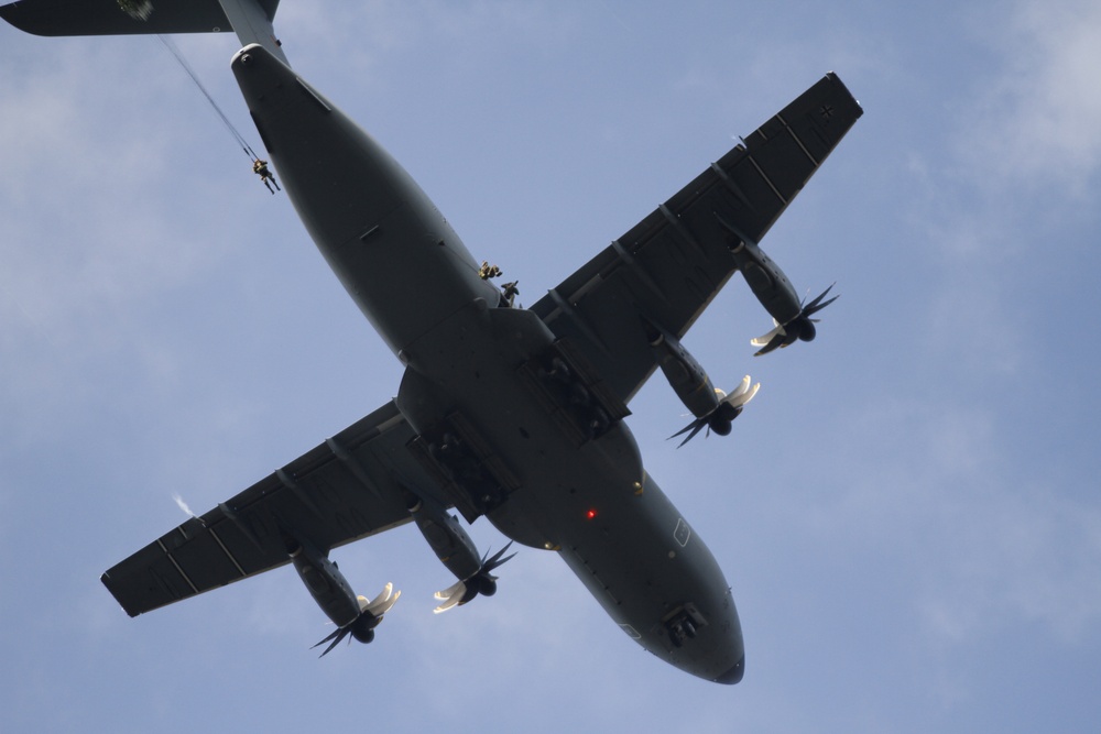 Paratroopers exit aircraft during Falcon Leap