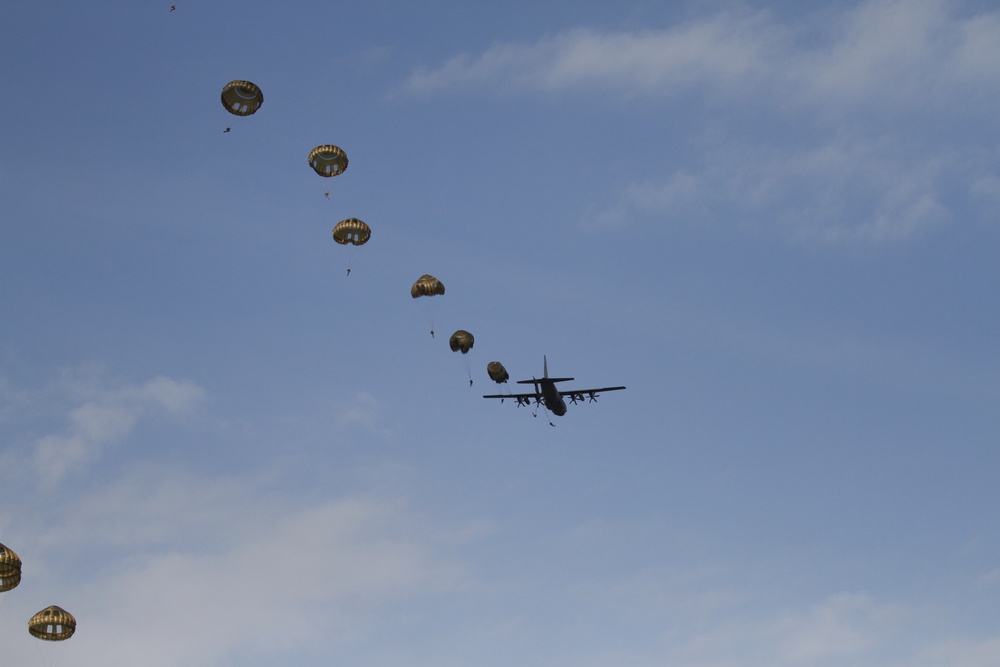 Paratroopers exit aircraft during Falcon Leap