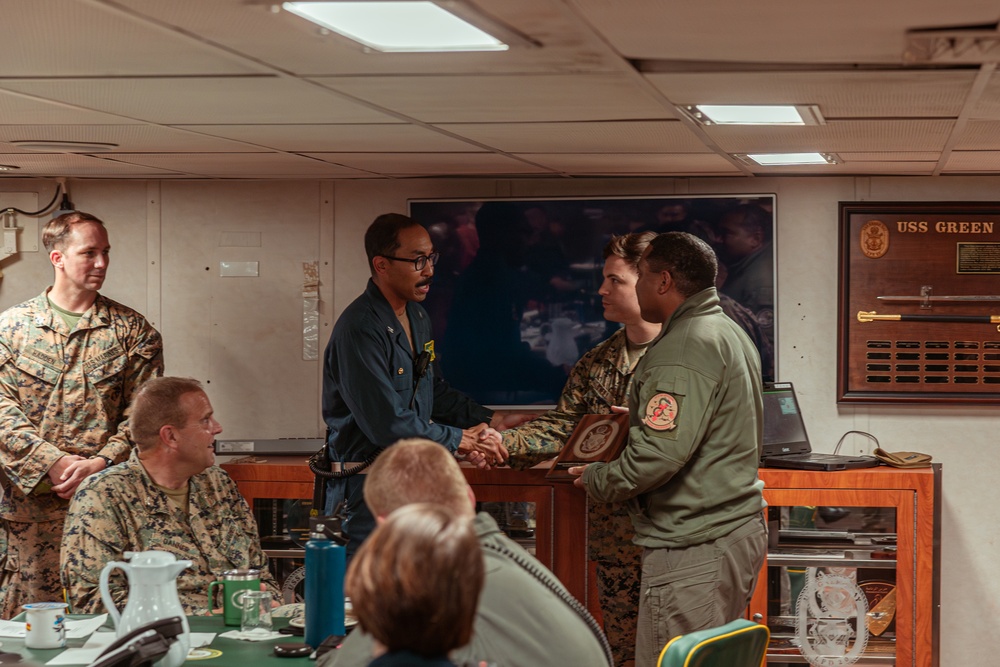 U.S. Marines with the 31st MEU Present Gifts to the USS Green Bay Team