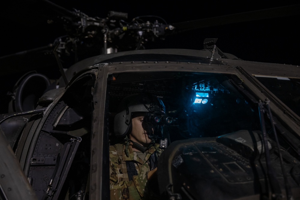 U.S. Army Pilot conducts a pre-flight checks