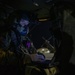 U.S. Army Crew Chief checks a onboard computer