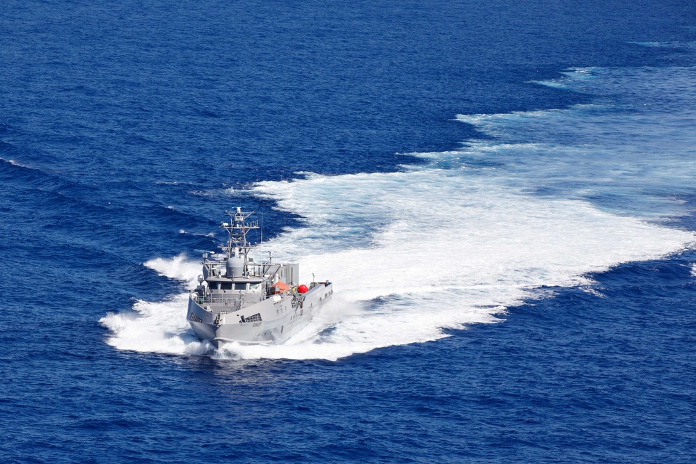 Unmanned Surface Vessels Steam Alongside USS Gabrielle Giffords