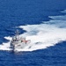 Unmanned Surface Vessels Steam Alongside USS Gabrielle Giffords