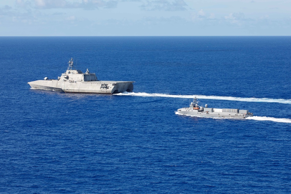 Unmanned Surface Vessels Steam Alongside USS Gabrielle Giffords