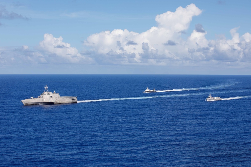 Unmanned Surface Vessels Steam Alongside USS Gabrielle Giffords