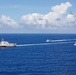 Unmanned Surface Vessels Steam Alongside USS Gabrielle Giffords