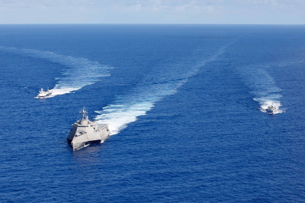 Unmanned Surface Vessels Steam Alongside USS Gabrielle Giffords