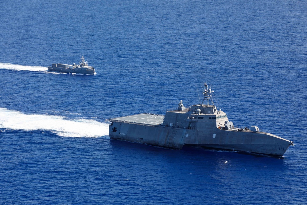 Unmanned Surface Vessels Steam Alongside USS Gabrielle Giffords