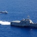 Unmanned Surface Vessels Steam Alongside USS Gabrielle Giffords