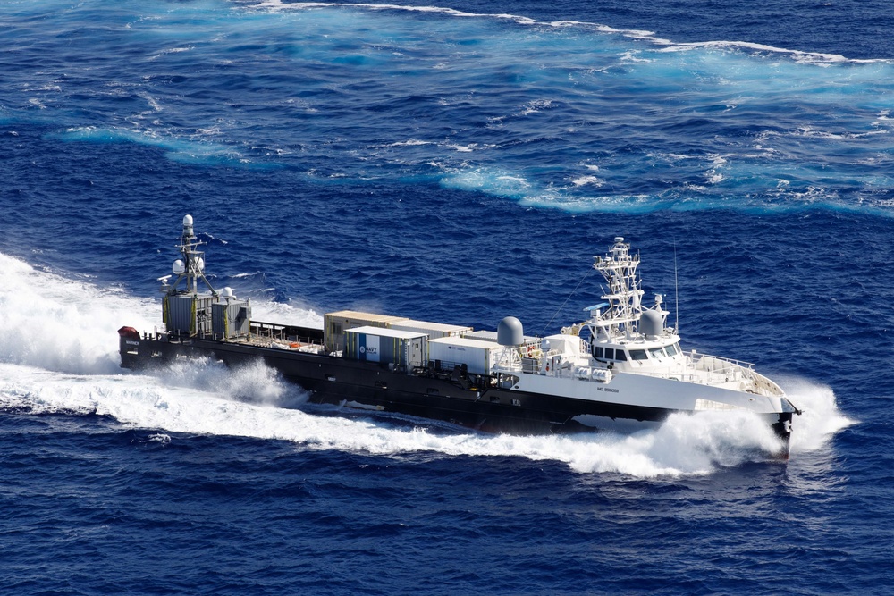 Unmanned Surface Vessels Steam Alongside USS Gabrielle Giffords