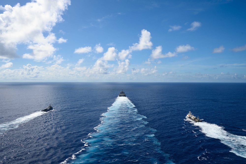 Unmanned Surface Vessels Steam Alongside USS Gabrielle Giffords