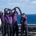 Sailors Drain A Hose