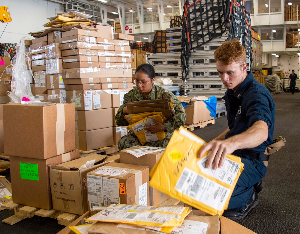 Sailors Sort Stock During a Storage Onload Aboard USS Carl Vinson (CVN 70)