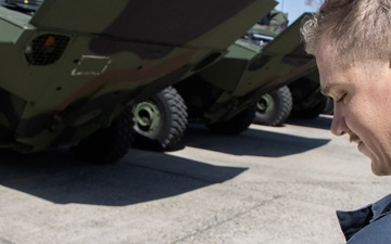 A Marine Corps Amphibious Combat Vehicle operator reviews the Assault Amphibian Community Website
