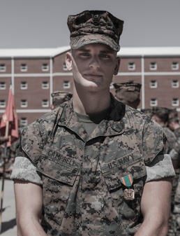 HM3 Campbell receives a Navy and Marine Corps Achievement Medal