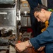 USS Ronald Reagan (CVN 76) Sailors install dishwasher