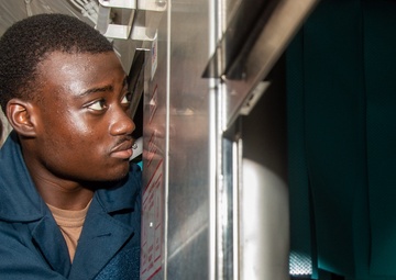 USS Ronald Reagan (CVN 76) Sailors install dishwasher