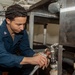 USS Ronald Reagan (CVN 76) Sailors install dishwasher