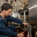 USS Ronald Reagan (CVN 76) Sailors install dishwasher