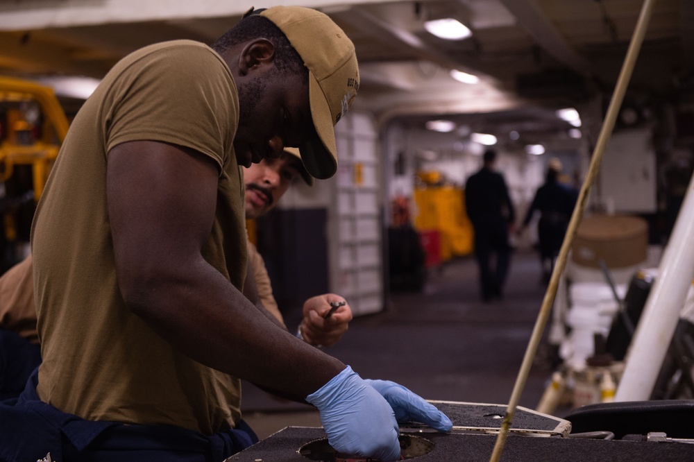 USS Ronald Reagan (CVN 76) Sailors conduct daily maintenance