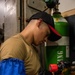 USS Ronald Reagan (CVN 76) Sailors change lube oil cap