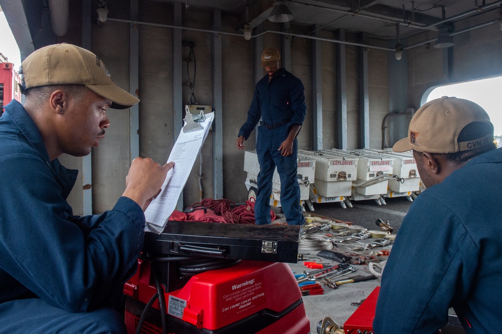 USS Ronald Reagan (CVN 76) Sailors conduct flight deck maintenance