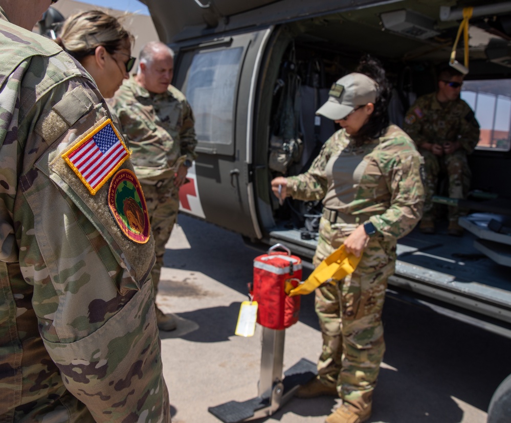 U.S. resuscitative and surgical team learns patient transport in a Blackhawk