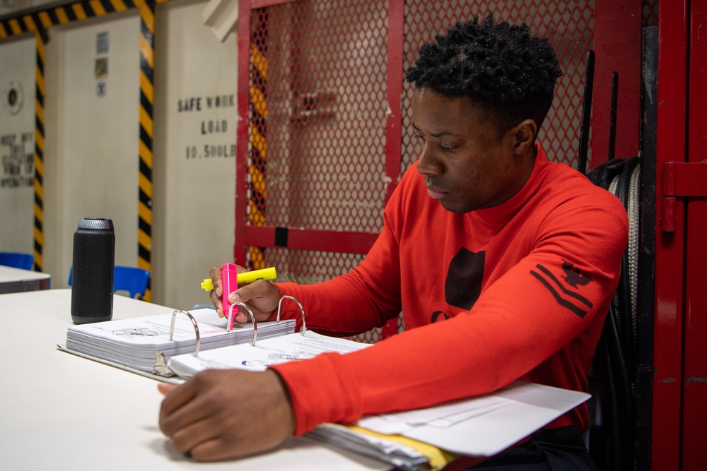 U.S. Navy Sailor Studies For Exam