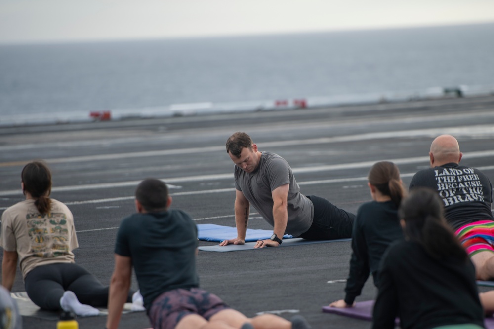 U.S. Navy Sailors Do Yoga On Flight Deck