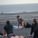 U.S. Navy Sailors Do Yoga On Flight Deck