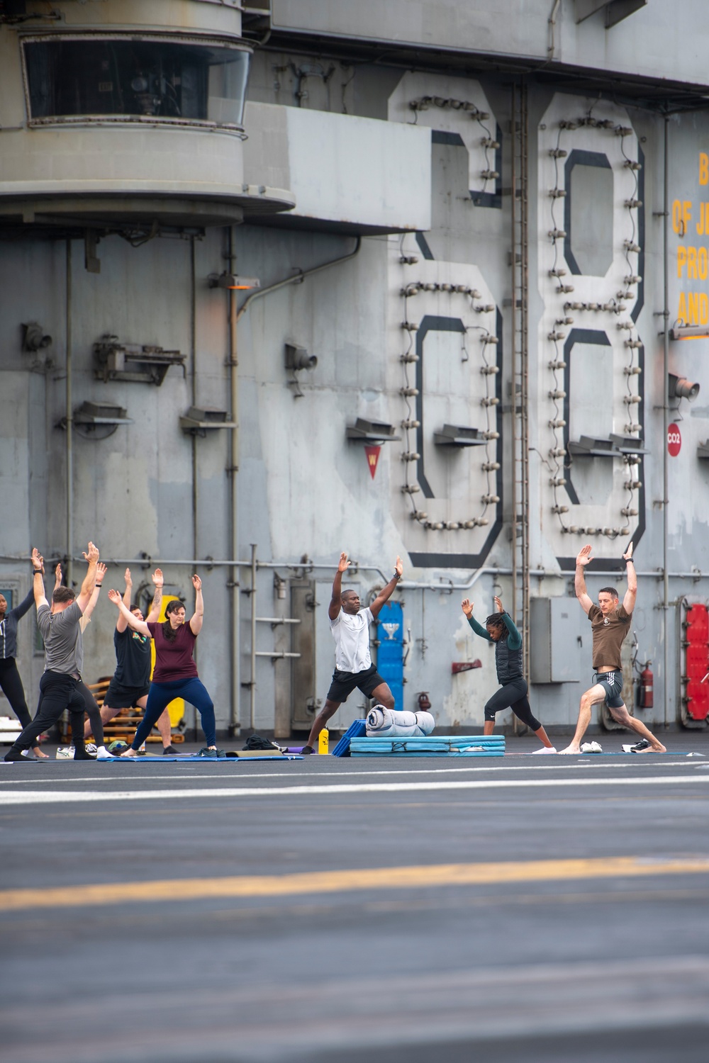 U.S. Navy Sailors Do Yoga On Flight Deck