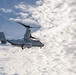 A CMV-22B Osprey Flies Alongside USS Nimitz