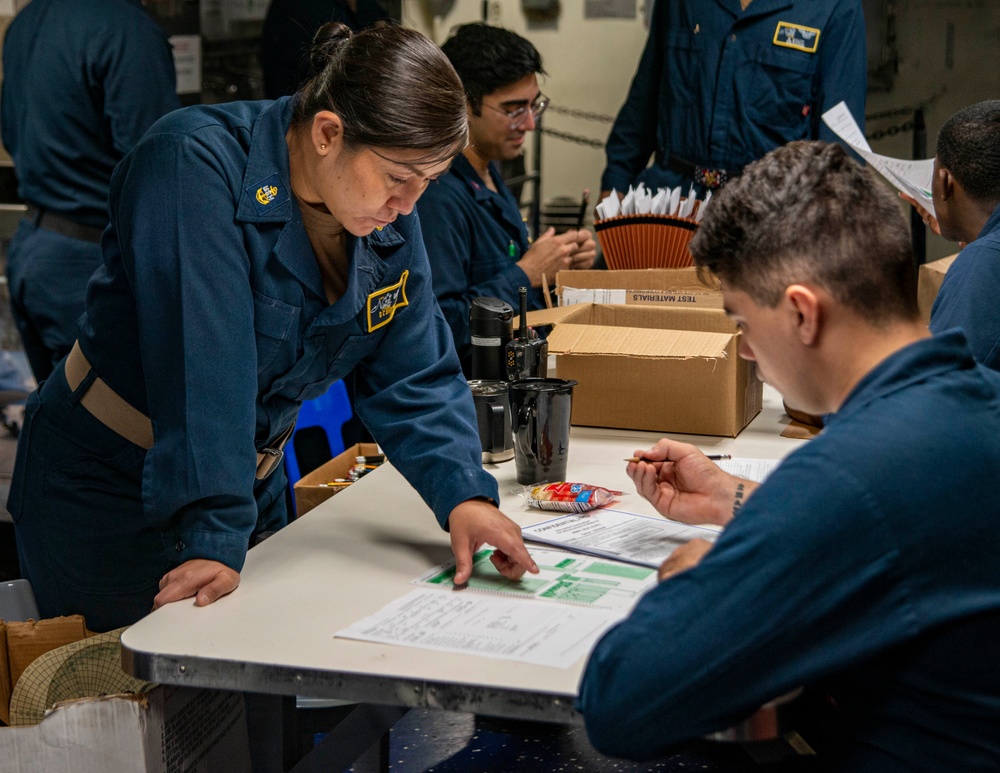 Chief Instructs Sailor During Advancement Exam