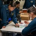 Chief Instructs Sailor During Advancement Exam