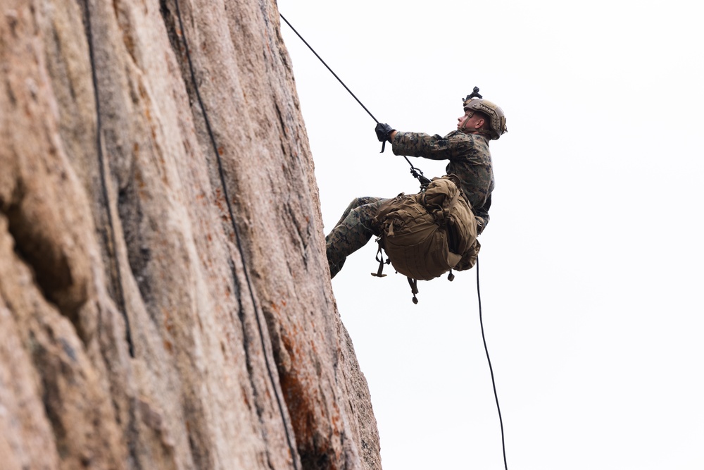 Marines with 1st Bn., 1st Marines master maneuvering across cliff face