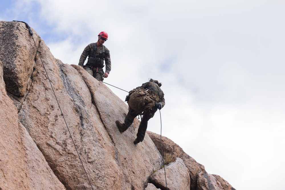 Marines with 1st Bn., 1st Marines master maneuvering across cliff face