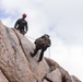 Marines with 1st Bn., 1st Marines master maneuvering across cliff face