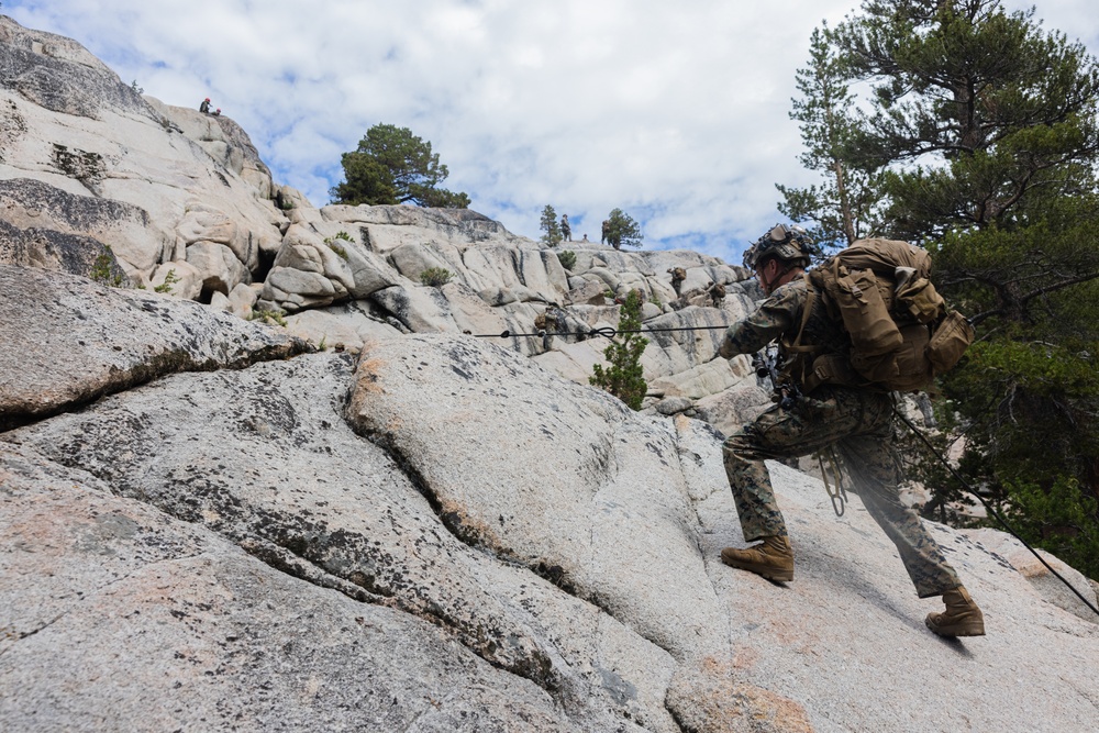 Marines with 1st Bn., 1st Marines master maneuvering across cliff face