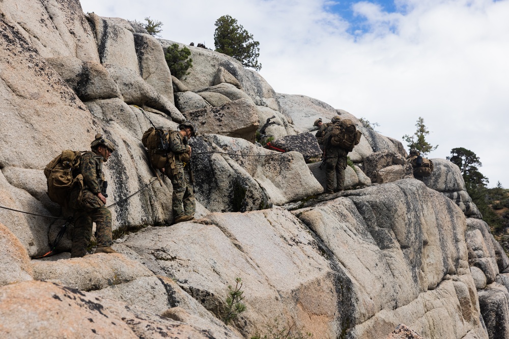 Marines with 1st Bn., 1st Marines master maneuvering across cliff face