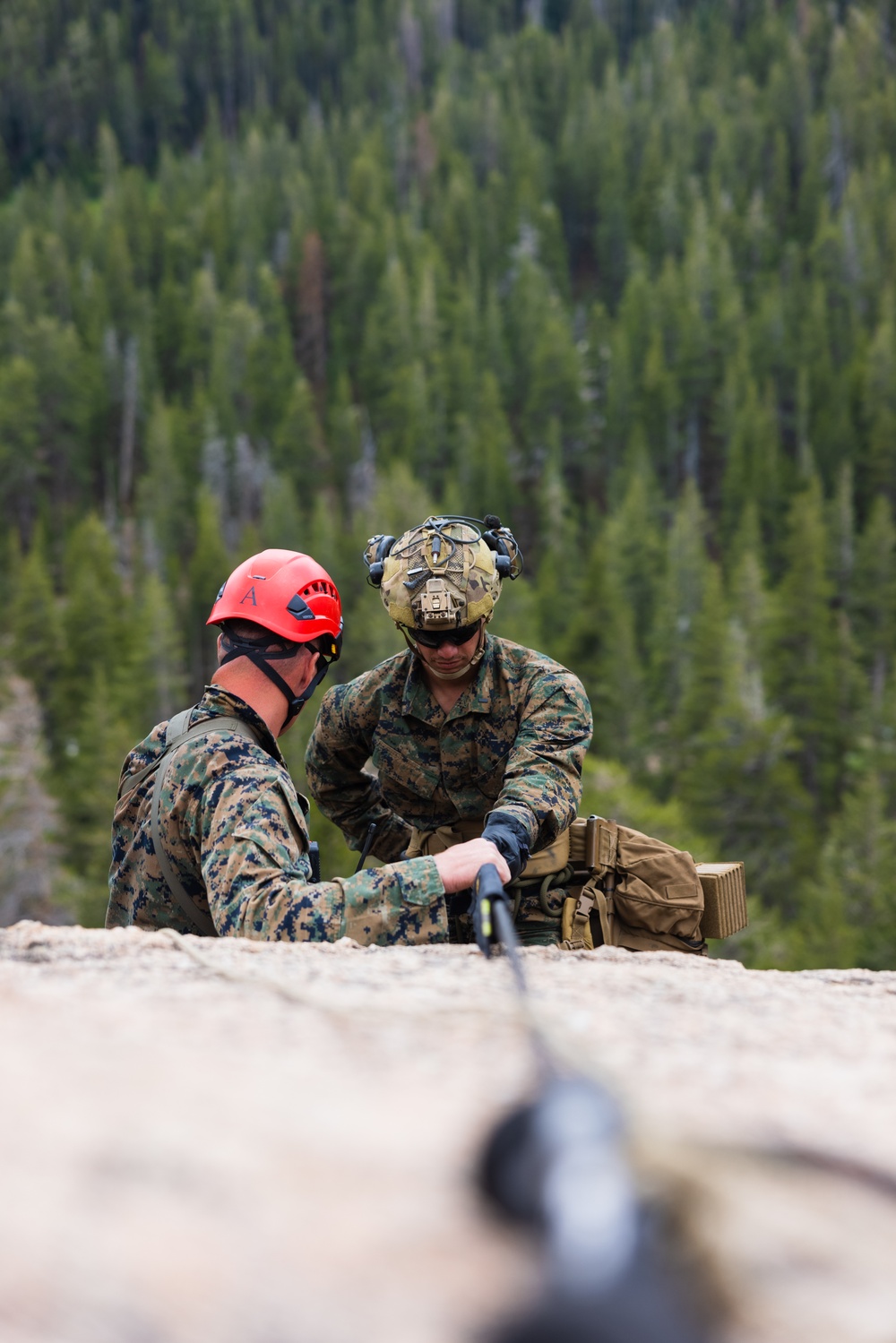 Marines with 1st Bn., 1st Marines master maneuvering across cliff face