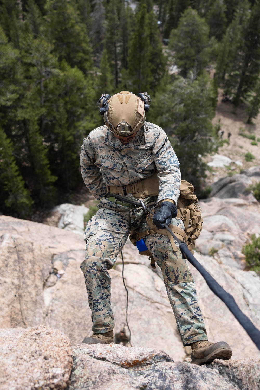 Marines with 1st Bn., 1st Marines master maneuvering across cliff face