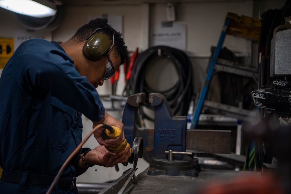 Sailor Grinds Metal