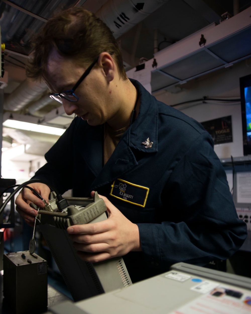 Sailor Prepares To Calibrate Component