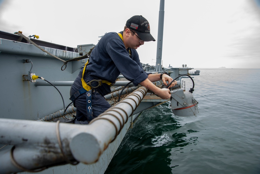 Sailor Sets Up Waterline Security Lights