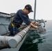 Sailor Sets Up Waterline Security Lights