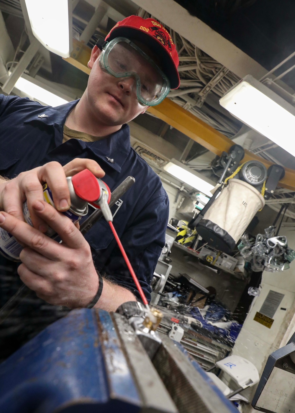 USS Dewey (DDG 105) Sailors Conduct Routine Operations in the Ship's General Workshop