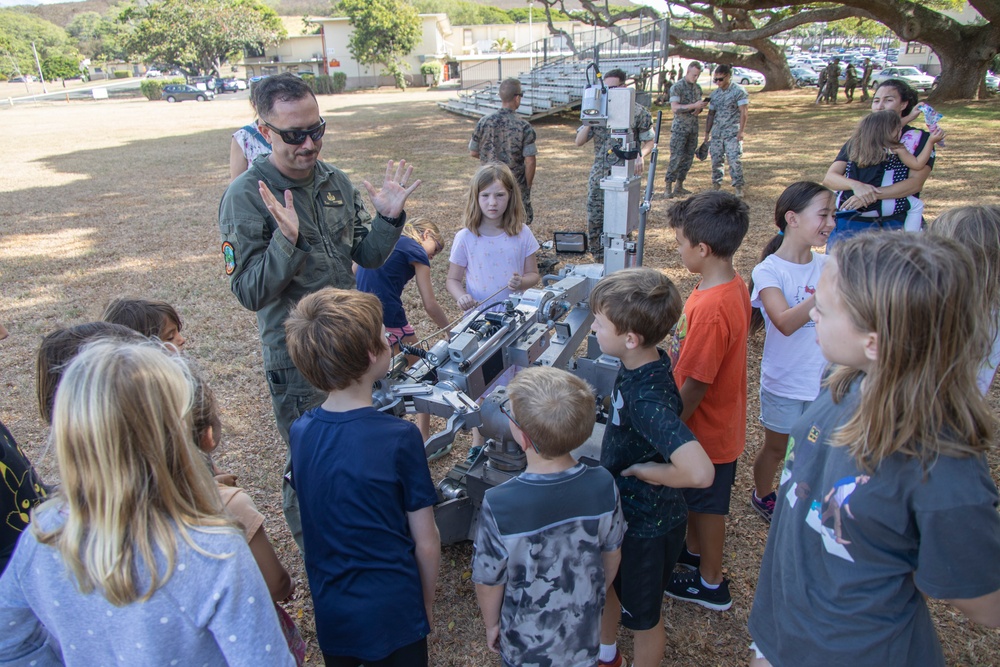 Armed with Knowledge: Military Homeschoolers of Hawaii receive military technology demonstration.