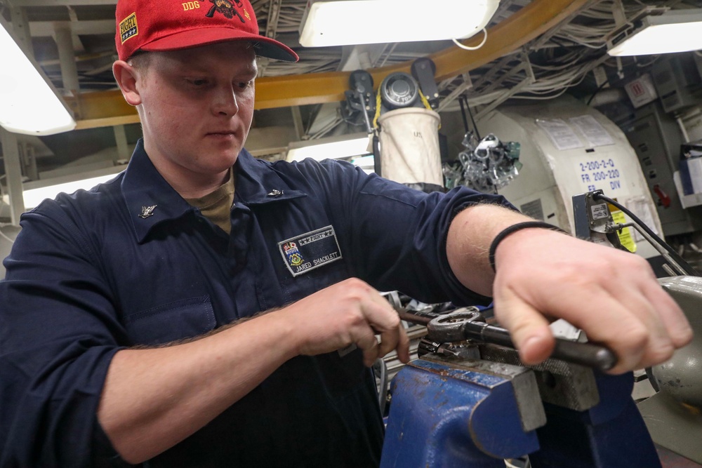 USS Dewey (DDG 105) Sailors Conduct Routine Operations in the Ship's General Workshop